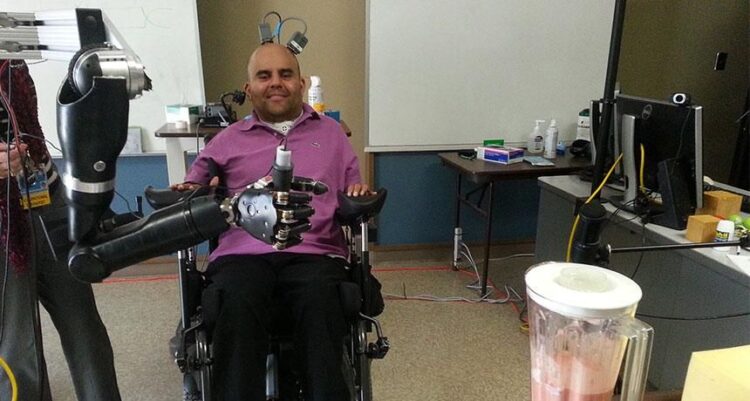 Paralyzed Man Controls Robotic Arm